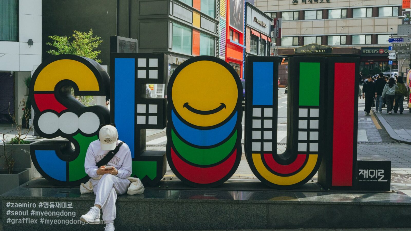 A vibrant Seoul sign in Myeongdong, South Korea, capturing the bustling street vibe.