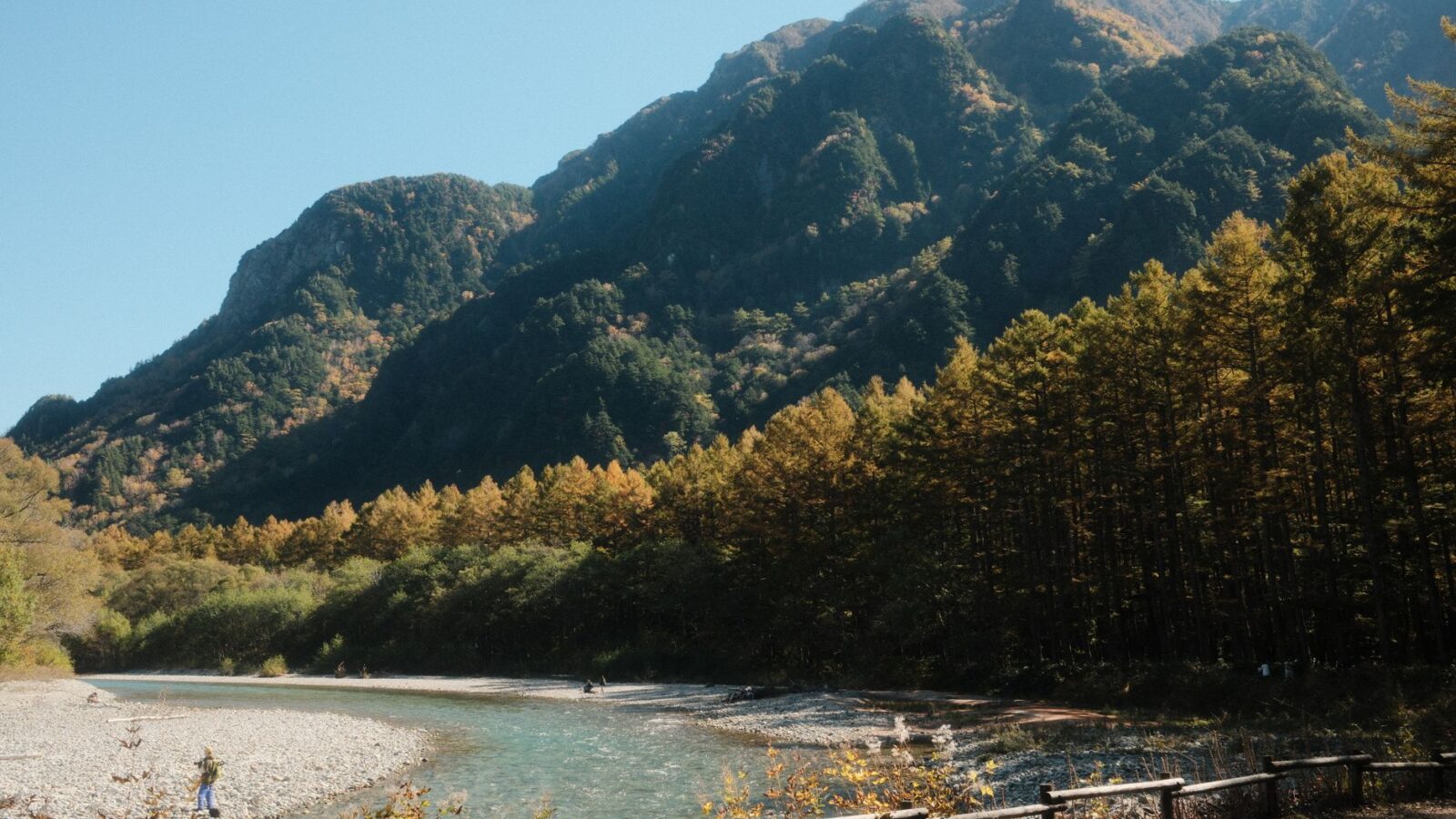 Beautiful view of mountains and a river in Matsumoto, Japan during fall season.