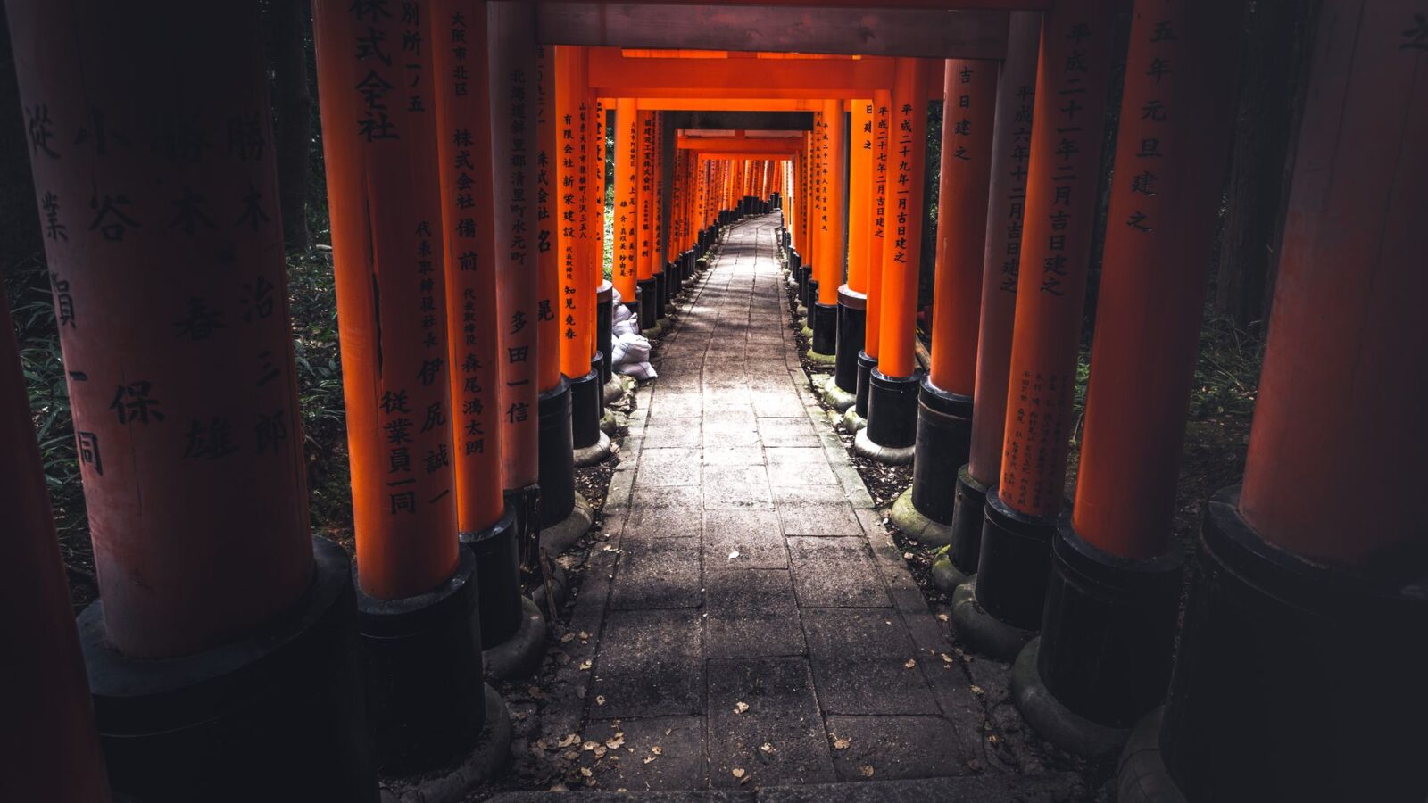 Captivating view of the iconic torii gate tunnel at Fushimi Inari Shrine in Kyoto, Japan.